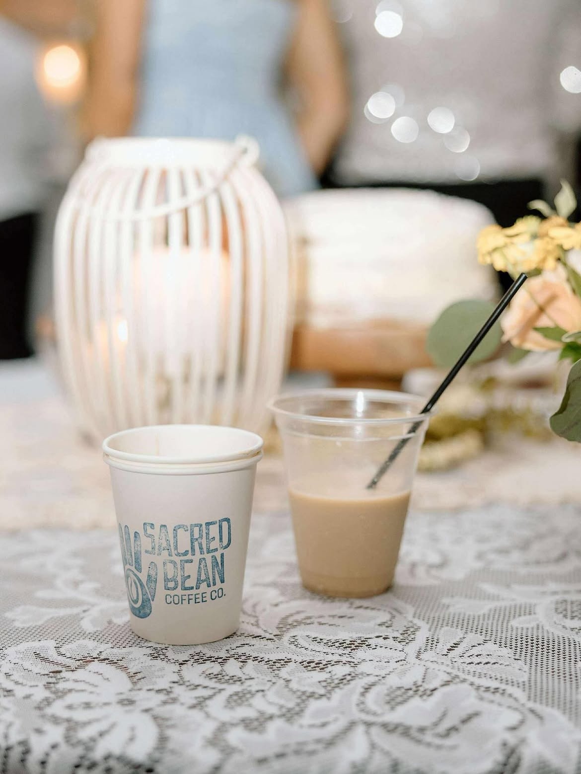Sacred Bean cup at a candlelit wedding reception