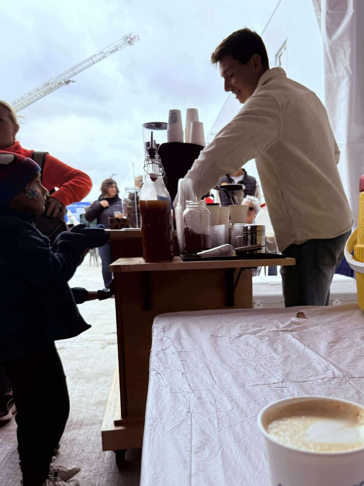 Sacred Bean pop-up serving guests at an outdoor event